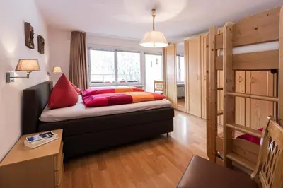 Ein Bett oder Betten in einem Zimmer der Unterkunft Spacious Corner apartment in Aparthotel Kleinwalsertal