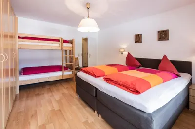 Ein Bett oder Betten in einem Zimmer der Unterkunft Spacious Corner apartment in Aparthotel Kleinwalsertal