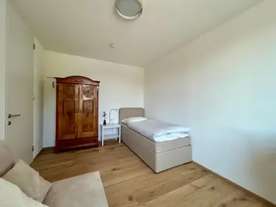 Ein Bett oder Betten in einem Zimmer der Unterkunft Seeparkvilla – Wohlfühlen am See und im Grünen