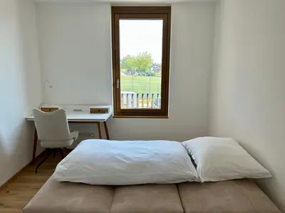 Ein Bett oder Betten in einem Zimmer der Unterkunft Seeparkvilla – Wohlfühlen am See und im Grünen