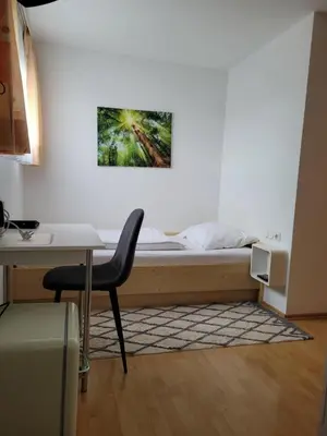 Ein Bett oder Betten in einem Zimmer der Unterkunft Gästezimmer Suppan