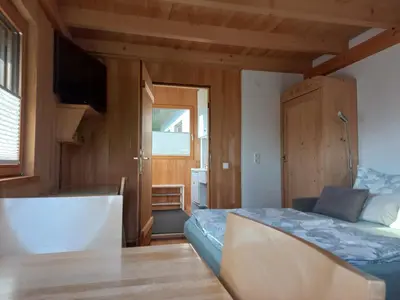 Ein Bett oder Betten in einem Zimmer der Unterkunft Ferienwohnung in Schwarzach Vorarlberg