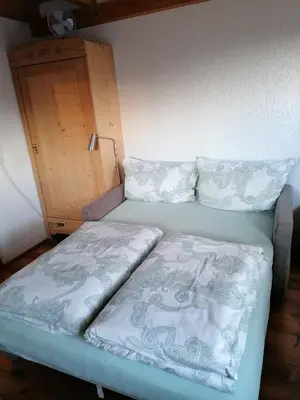 Ein Bett oder Betten in einem Zimmer der Unterkunft Ferienwohnung in Schwarzach Vorarlberg