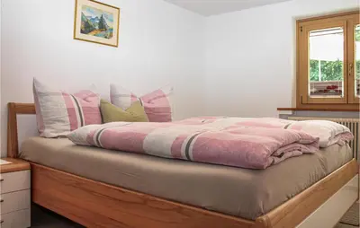 Ein Bett oder Betten in einem Zimmer der Unterkunft Ferienwohnung - Wald Am Arlb