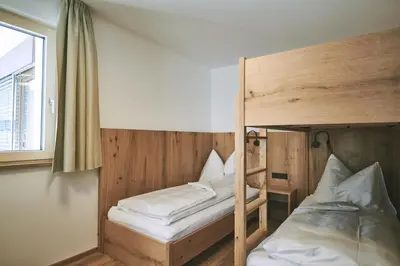 Ein Bett oder Betten in einem Zimmer der Unterkunft Brandnerhof