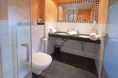 Ein Badezimmer in der Unterkunft Hotel Garni Brigitte