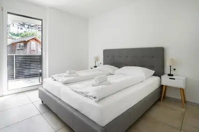 Ein Bett oder Betten in einem Zimmer der Unterkunft homy City Lodge in Feldkirch, Grenznähe und doch Zentral