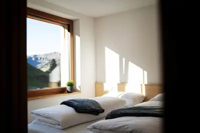 Ein Bett oder Betten in einem Zimmer der Unterkunft Berg Aparts - Top 6 - Faschina - mit Sauna & 2 Bädern