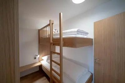 Ein Bett oder Betten in einem Zimmer der Unterkunft Faschina Apartment - Top 4