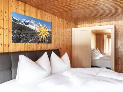 Ein Bett oder Betten in einem Zimmer der Unterkunft Ferienhaus Alpenflora