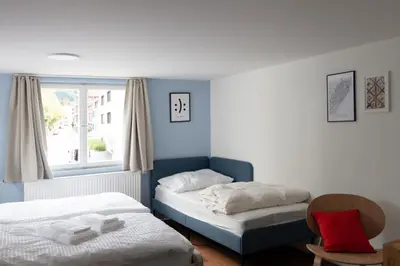 Ein Bett oder Betten in einem Zimmer der Unterkunft STADTHAUS M42 Dornbirn - Apartment Top 4