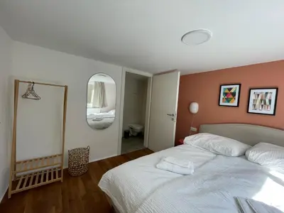 Ein Bett oder Betten in einem Zimmer der Unterkunft STADTHAUS M42 Dornbirn - Apartment Top 6