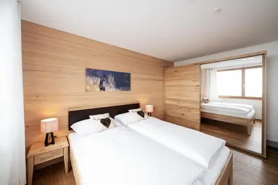 Ein Bett oder Betten in einem Zimmer der Unterkunft Berg Aparts Faschina - 02 - b42789