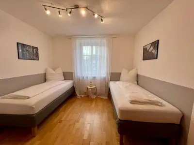 Ein Bett oder Betten in einem Zimmer der Unterkunft Stadthaus 1911