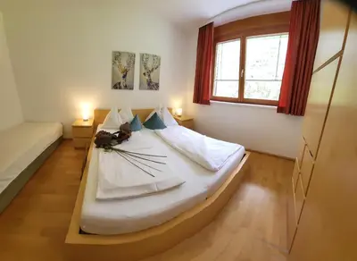 Ein Bett oder Betten in einem Zimmer der Unterkunft Top Appartements