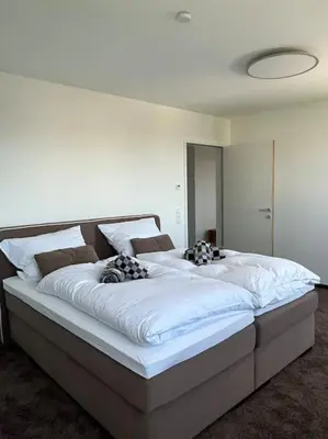 Ein Bett oder Betten in einem Zimmer der Unterkunft Sonnige Wohnung mit schöner Aussicht in Wolfurt