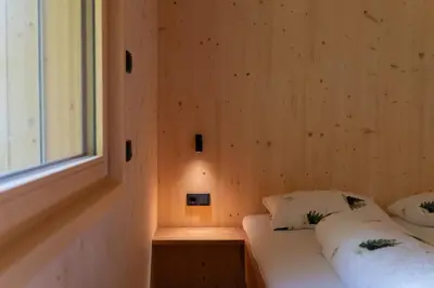 Ein Bett oder Betten in einem Zimmer der Unterkunft Haus Kanabe