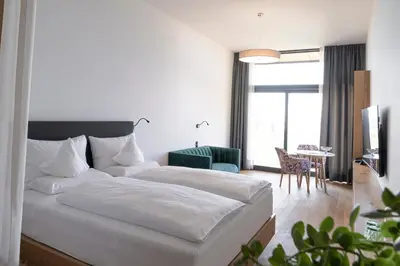 Ein Bett oder Betten in einem Zimmer der Unterkunft Fritsch am Berg - Adults only