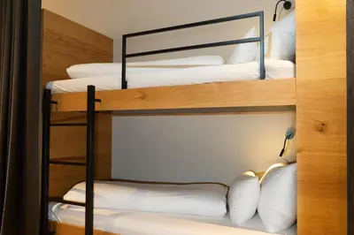 Ein Bett oder Betten in einem Zimmer der Unterkunft Heimat 1495m Appartement TYP 2