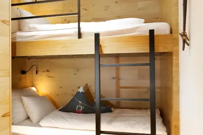 Ein Bett oder Betten in einem Zimmer der Unterkunft Heimat 1495m Appartement TYP 3