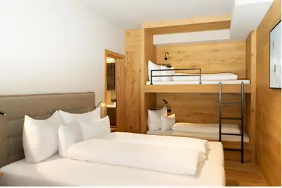 Ein Bett oder Betten in einem Zimmer der Unterkunft Heimat 1495m Appartement TYP 5