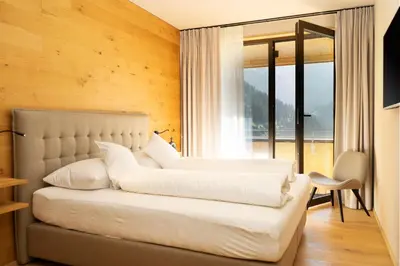 Ein Bett oder Betten in einem Zimmer der Unterkunft Heimat 1495m Appartement TYP 6