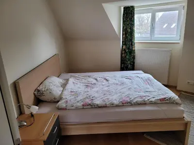 Ein Bett oder Betten in einem Zimmer der Unterkunft Ferienwohnung Dornbirn City
