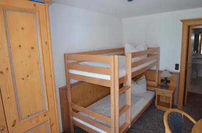 Ein Bett oder Betten in einem Zimmer der Unterkunft Alpenhotel Widderstein