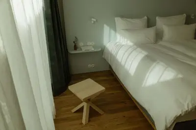 Ein Bett oder Betten in einem Zimmer der Unterkunft kleiner Löwe – Stadthotel Bregenz