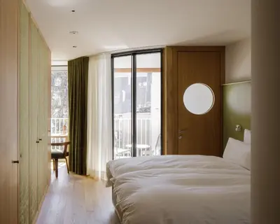 Ein Bett oder Betten in einem Zimmer der Unterkunft kleiner Löwe – Stadthotel Bregenz