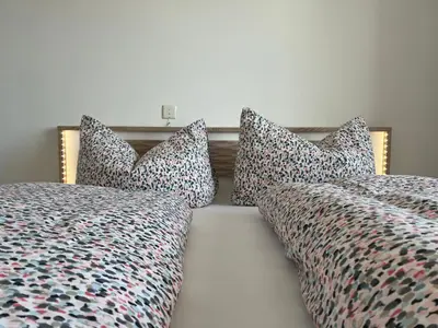 Ein Bett oder Betten in einem Zimmer der Unterkunft Panorama Appartements