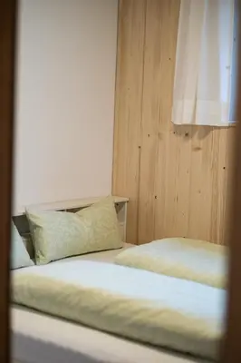 Ein Bett oder Betten in einem Zimmer der Unterkunft Ferienwohnung Himmelmoos