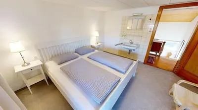Ein Bett oder Betten in einem Zimmer der Unterkunft Ninis - Ferienhaus im Bregenzerwald