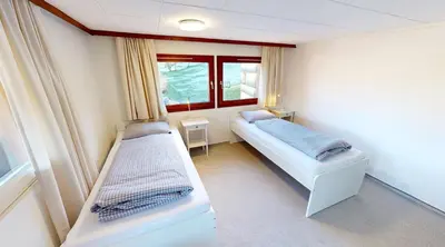Ein Bett oder Betten in einem Zimmer der Unterkunft Ninis - Ferienhaus im Bregenzerwald