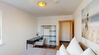 Ein Bett oder Betten in einem Zimmer der Unterkunft CROWN LIVING Design Apartment Dornbirn - zentral Gelegen, WLAN, kostenlosem Parkplatz und Self Check-in, ideal für Geschäftsreisende und Feriengäste