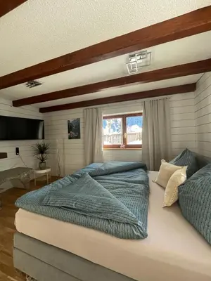 Ein Bett oder Betten in einem Zimmer der Unterkunft Ferienwohnung Jägerheim