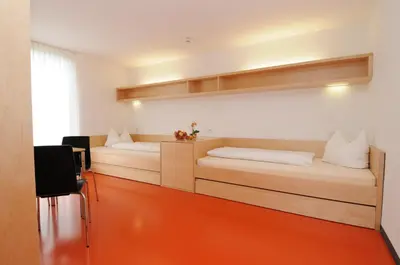 Ein Bett oder Betten in einem Zimmer der Unterkunft Olympiazentrum Vorarlberg