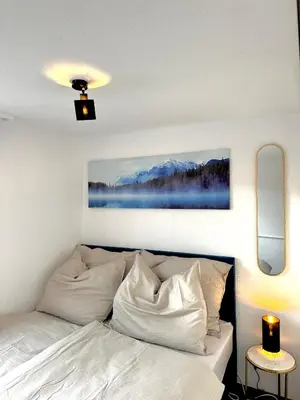 Ein Bett oder Betten in einem Zimmer der Unterkunft Zentrale Wohnung mit Dachterasse