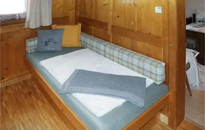 Ein Bett oder Betten in einem Zimmer der Unterkunft Ferienhaus - Wald Am Arlberg