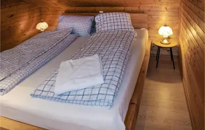 Ein Bett oder Betten in einem Zimmer der Unterkunft Ferienhaus - Wald Am Arlberg
