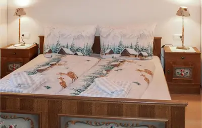 Ein Bett oder Betten in einem Zimmer der Unterkunft Ferienhaus - Wald Am Arlberg
