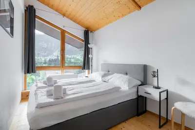 Ein Bett oder Betten in einem Zimmer der Unterkunft homy Alpine Deluxe Chalet in St Anton im Montafon