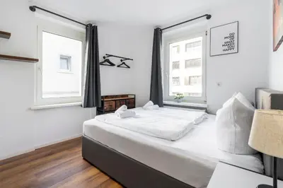 Ein Bett oder Betten in einem Zimmer der Unterkunft homy Lakeside Symphony in Bregenz am Bodensee