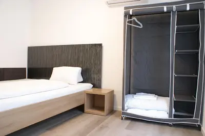 Ein Bett oder Betten in einem Zimmer der Unterkunft STAGE4