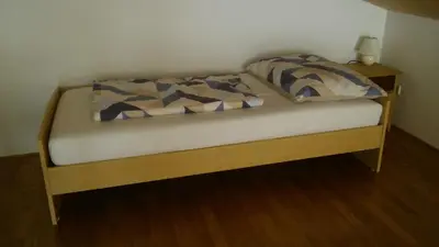 Ein Bett oder Betten in einem Zimmer der Unterkunft Studio Bergblick