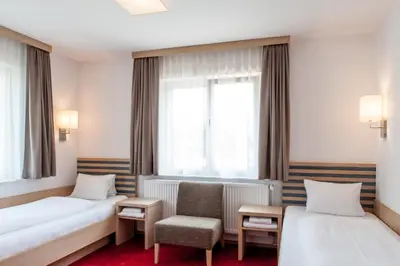 Ein Bett oder Betten in einem Zimmer der Unterkunft Gästehaus Brugger