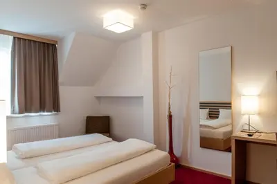 Ein Bett oder Betten in einem Zimmer der Unterkunft Gästehaus Brugger