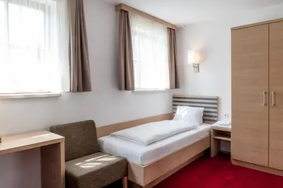Ein Bett oder Betten in einem Zimmer der Unterkunft Gästehaus Brugger