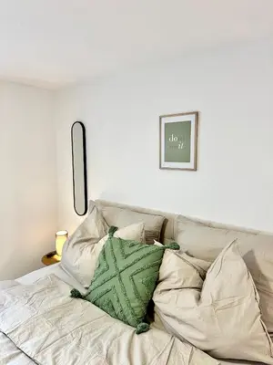 Ein Bett oder Betten in einem Zimmer der Unterkunft Stilvolles Wohnen am Hafen