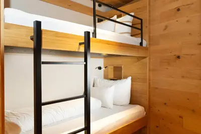 Ein Bett oder Betten in einem Zimmer der Unterkunft Heimat 1495m Appartement TYP 5 light